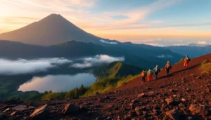 Hikers ascending Mount Rinjani at sunrise with lush greenery and volcanic landscape